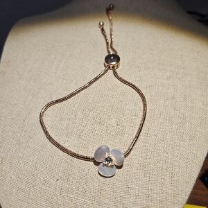 Kate Spade Rose Gold-tone disco pansy slider bracelet.